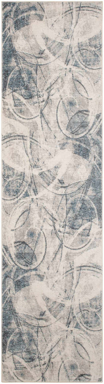 Close-up of Nourison Astra Silver Blue rug, featuring a modern abstract pattern in gray, blue, and white tones.