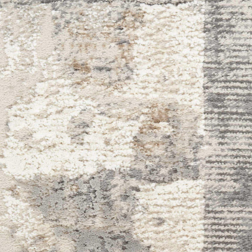 Close-up of the Nourison Sustainable Trends rug. Ivory, chestnut, and gray abstract pattern. Soft, textured weave.