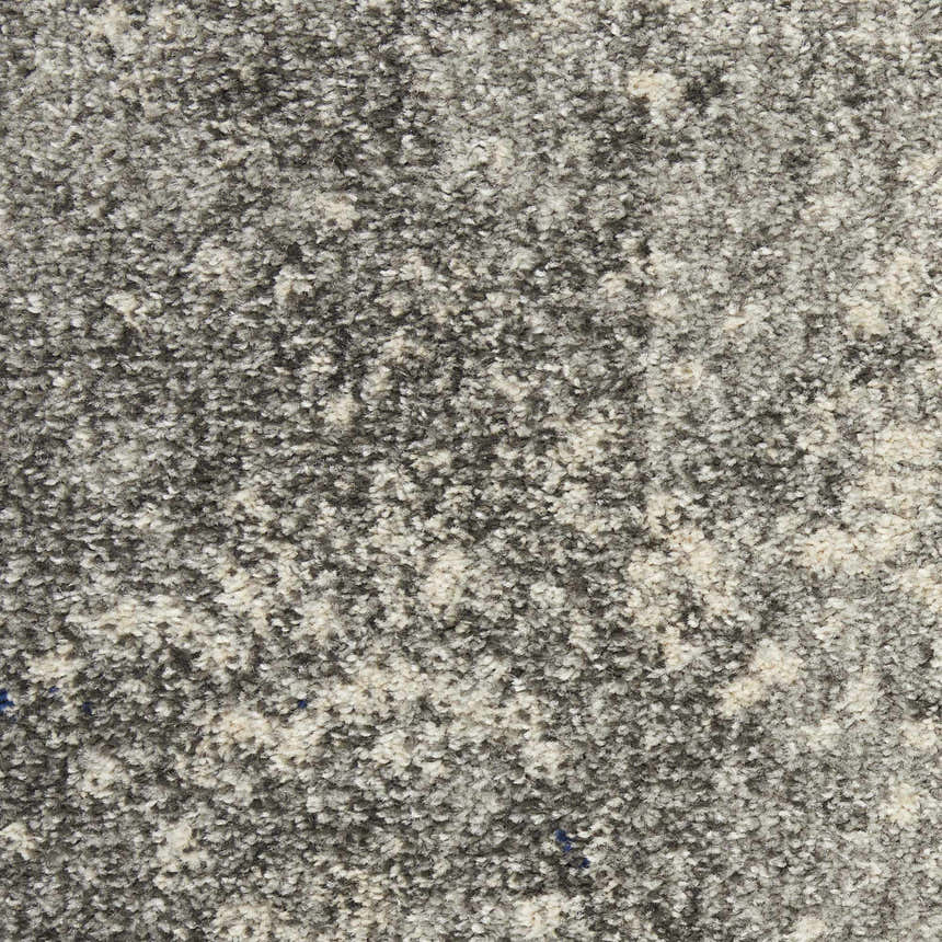 Close-up of the Nourison Passion Charcoal Ivory rug showing its textured, taupe, and ivory fibers.