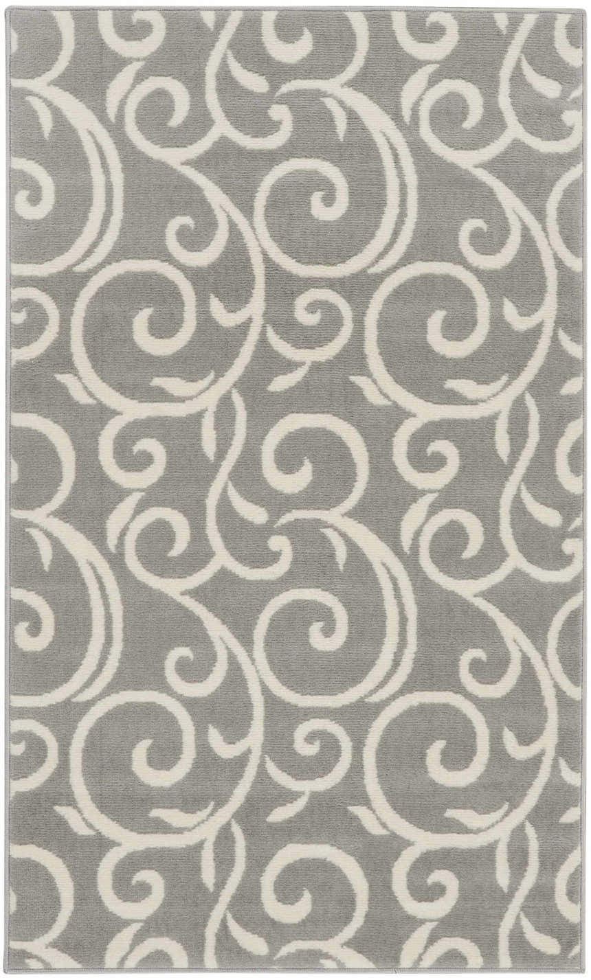 Close-up of a Nourison Grafix Grey Contemporary Indoor Area Rug with a swirling, ivory-colored pattern.