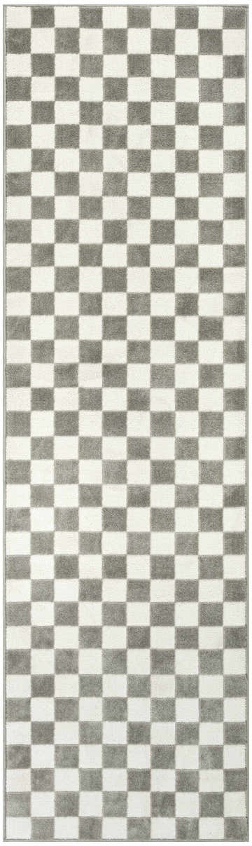 Close-up of the Nourison Serenity Home Ivory Grey rug, showcasing its checkerboard pattern and high pile texture.