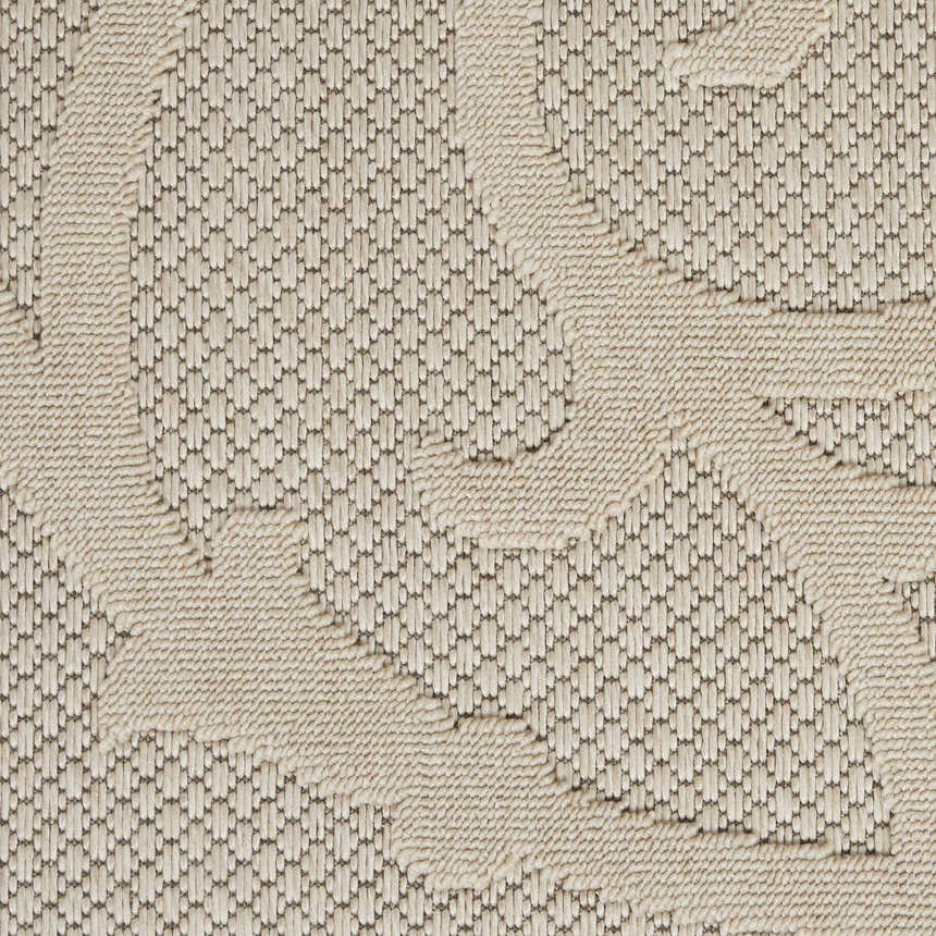 Close-up of the cream Nourison Cozumel rug. Farmhouse style rug with a textured, geometric pattern.