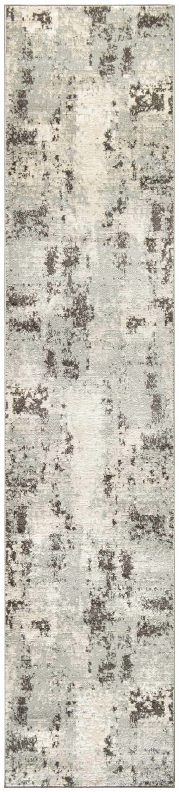 Close-up of the Nourison Serenity Home Ivory Grey rug, showcasing its abstract chestnut pattern and high-pile texture.