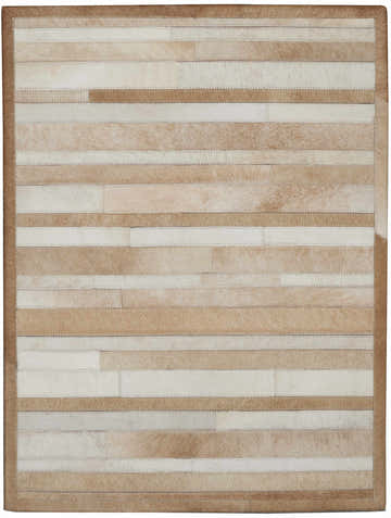 Close-up of the Calvin Klein Home Prairie Beige rug. Hair on hide rug with beige and cream stripes. Handmade.