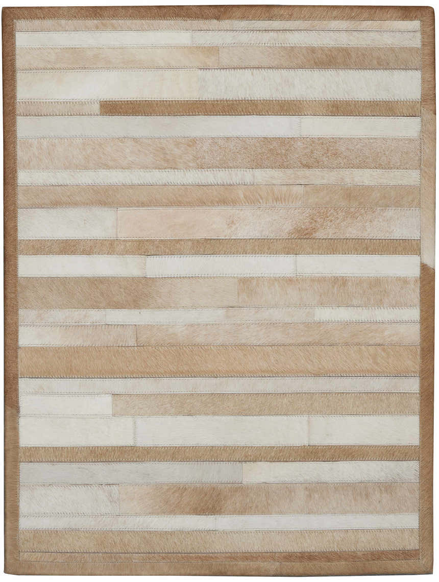 Close-up of the Calvin Klein Home Prairie Beige rug. Hair on hide rug with beige and cream stripes. Handmade.