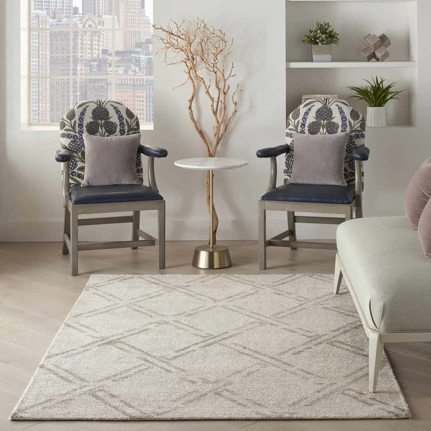 Modern living room with Nourison Venosa Ivory/Grey rug, chairs, and a city view. Mid-century modern style.