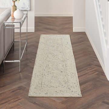 Hallway with Nourison Colorado Ivory Navy rug runner on herringbone wood floor.