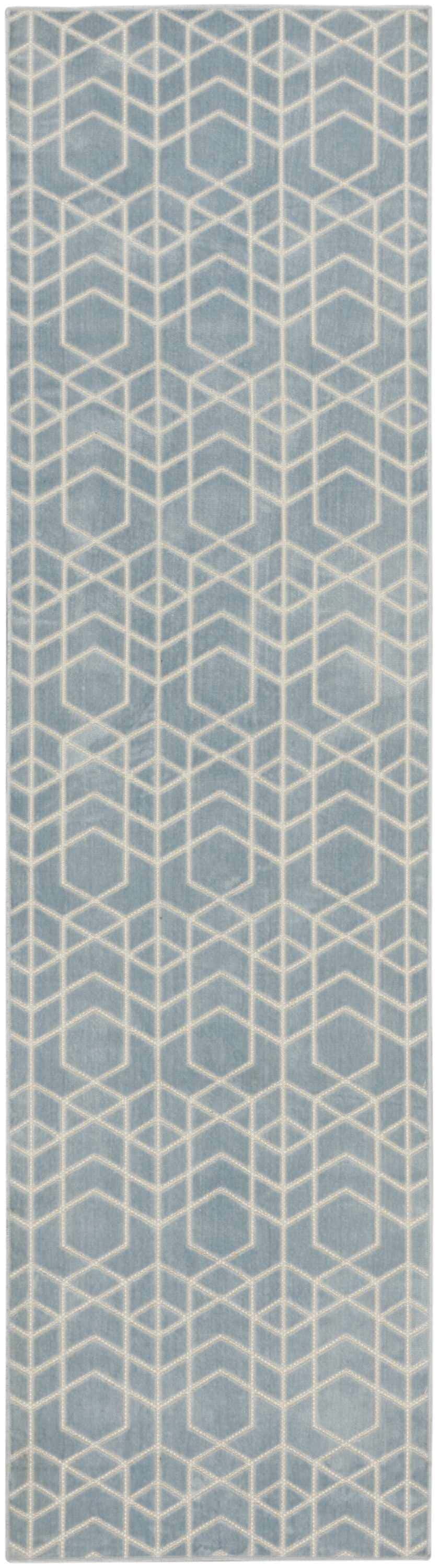 Close-up of Nourison Charm Blue Ivory rug, featuring a geometric pattern of diamonds and hexagons.