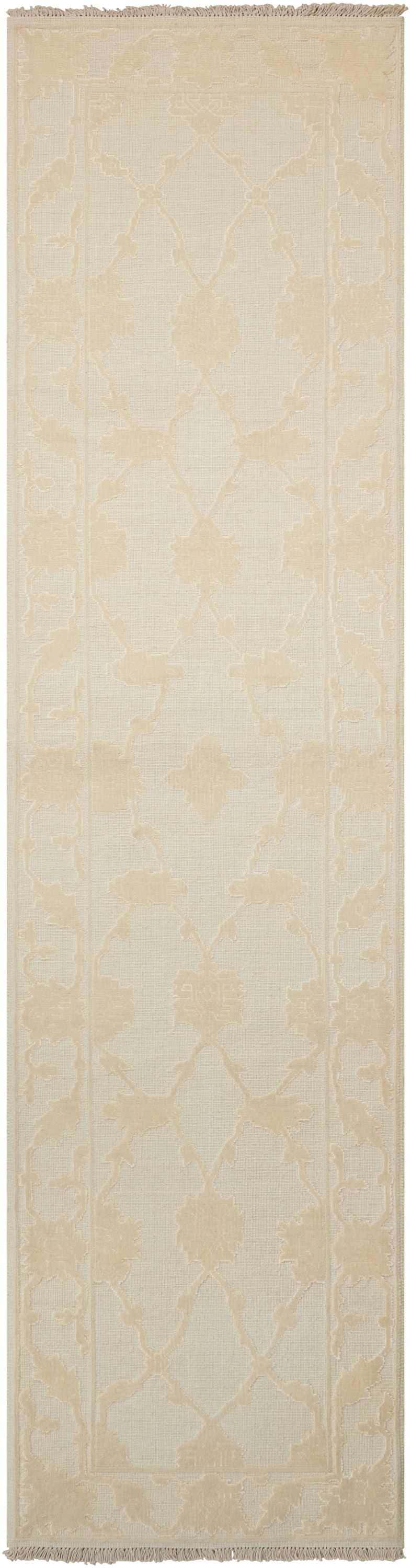 Close-up of Nourison Silk Pointe Ivory Vintage Runner Rug. Floral pattern in subtle chestnut tones. Handmade wool rug texture.