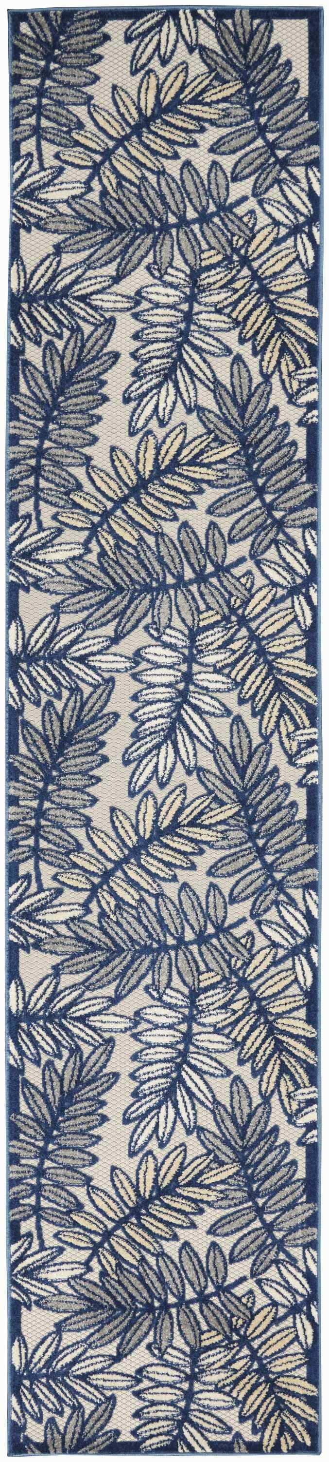Close-up of Nourison Aloha Ivory Navy Tropical Area Rug featuring a blue and beige leaf pattern.