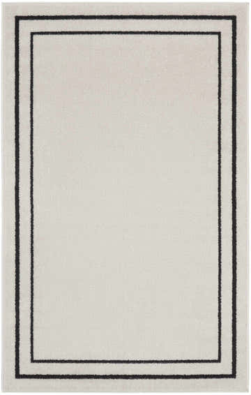 Close-up of the Nourison Essentials Ivory Black Contemporary Area Rug with a double black border.