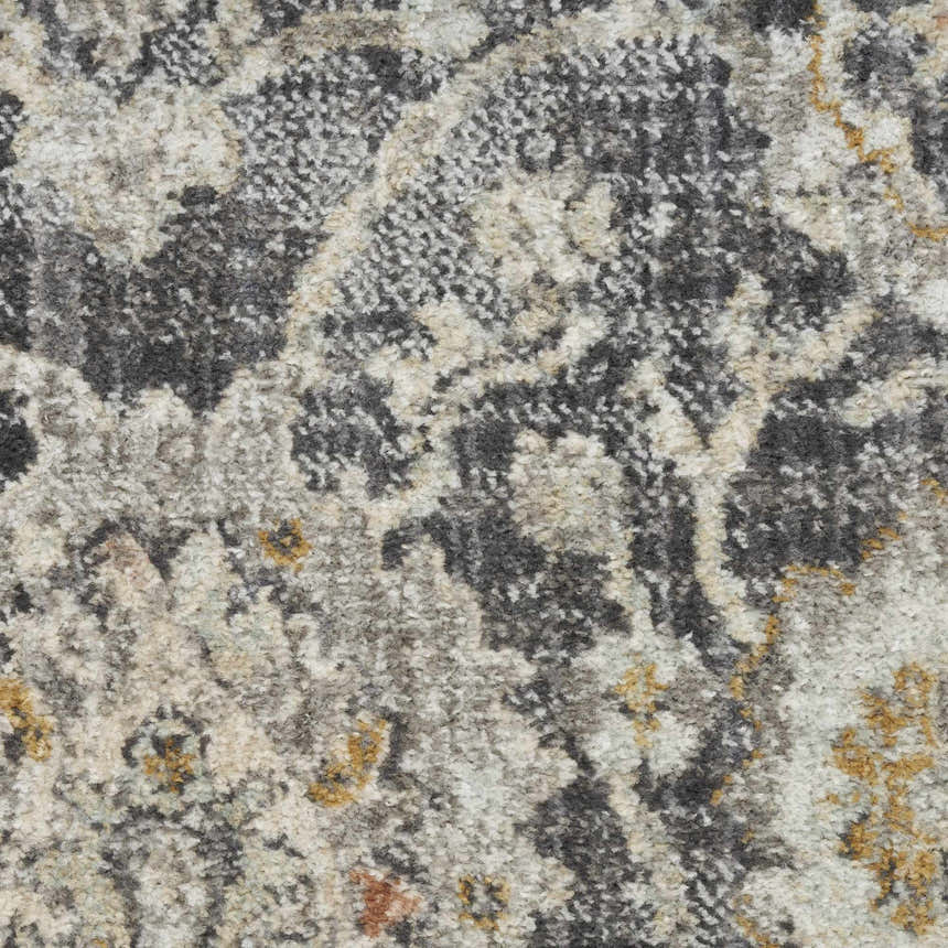 Close-up of the Nourison Oushak Home Charcoal rug. Vintage style with taupe, gray, and subtle gold tones.