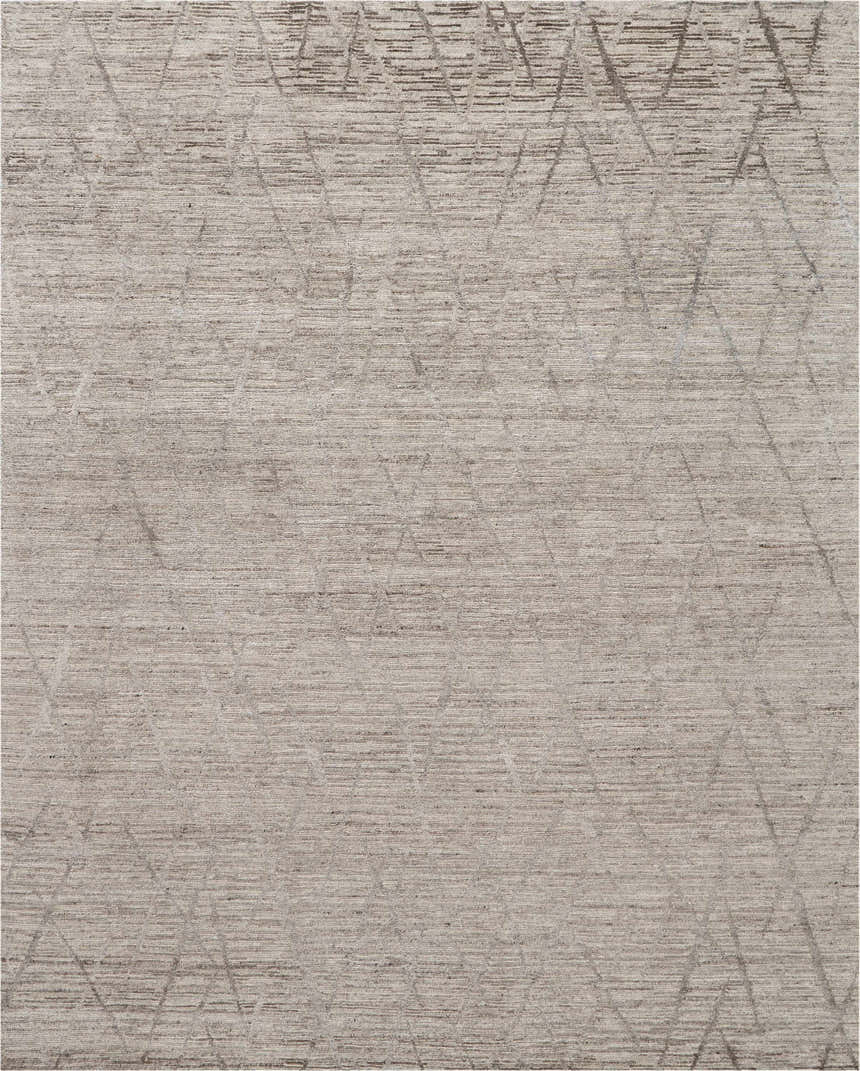 Close-up of the ash-colored Nourison OCEAN Area Rug featuring a subtle geometric pattern and textured, handmade construction.