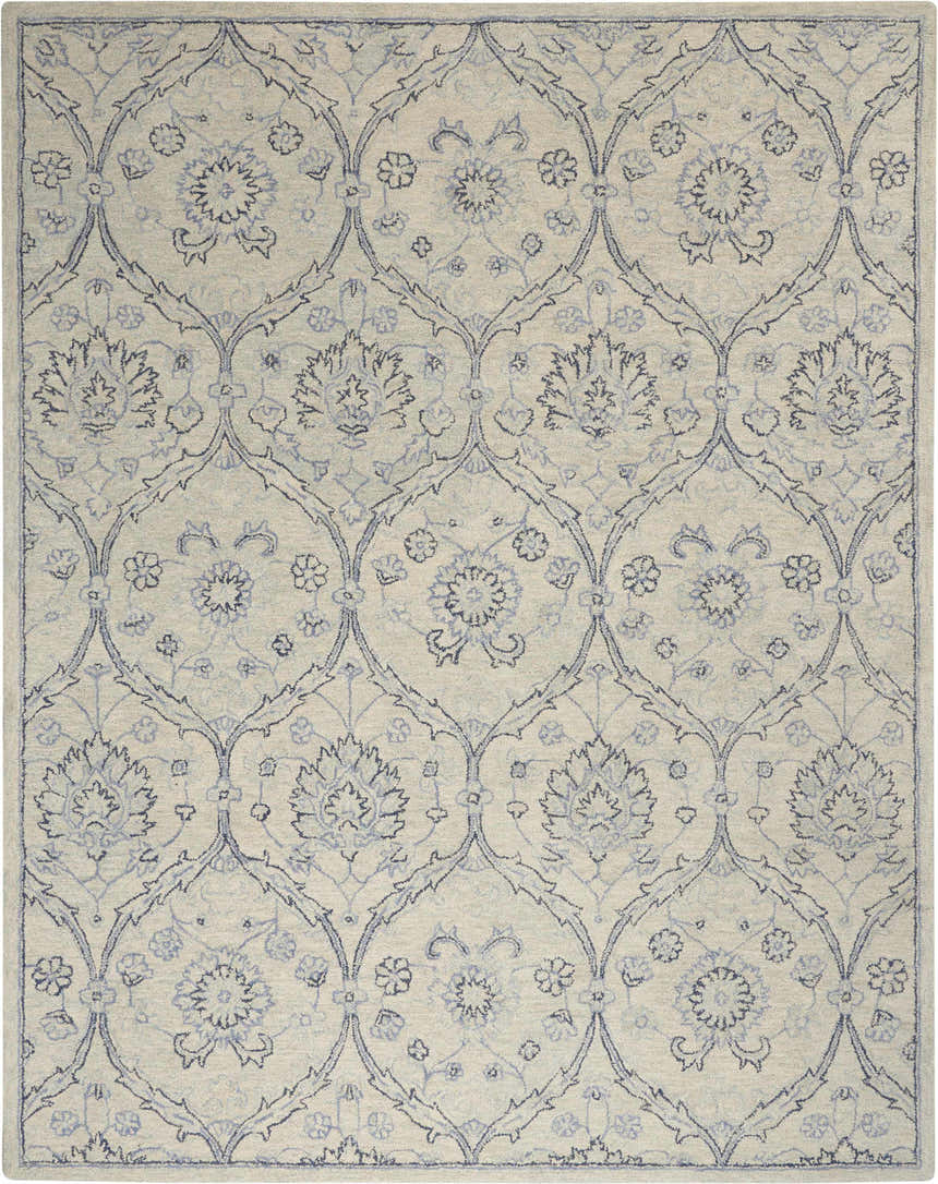 Close-up of Nourison Jazmine Ivory/Blue Persian rug. Handmade wool rug with floral and vine pattern.