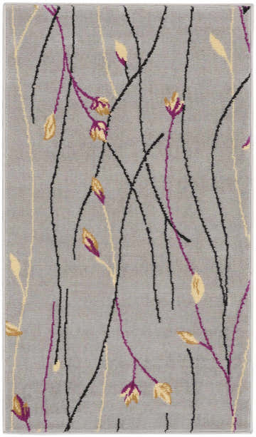 Close-up of Nourison Grafix Grey Contemporary Indoor Area Rug. Features black, purple, and gold floral design.