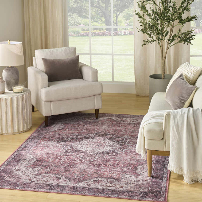 Living room scene with a Nourison Red Vintage Indoor Washable Area Rug, neutral furniture, and natural light.