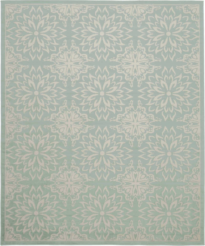 Close-up of Nourison Jubilant Ivory Green rug featuring a floral medallion pattern on a soft green background.