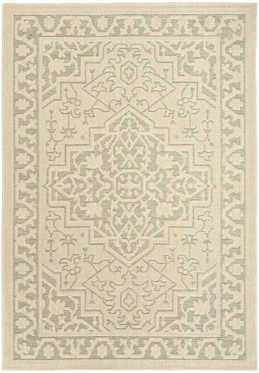 Close-up of a Nourison Tulum Taupe Olive outdoor rug. Features a geometric pattern in ivory and olive tones.