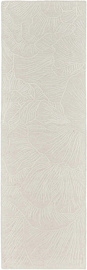 Close-up of the Nourison Avra Ivory rug. Creamy wool rug with a raised, abstract botanical design. Handmade texture.