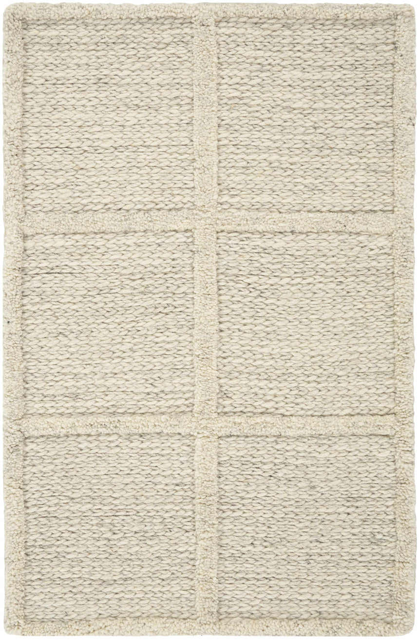 Close-up of the handmade DKNY Pure Framework Ivory rug. The wool rug has a subtle grid pattern and textured weave.