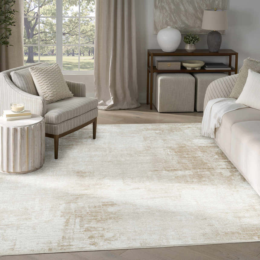 Living room scene with a Nourison Dekor Ivory Beige rug, neutral furniture, and natural light from a large window.