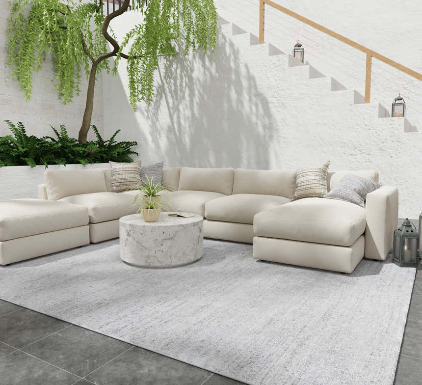 Modern patio design with a cream sectional sofa on a Feizy Finley Silver Area Rug. Roomscene-Rectangle