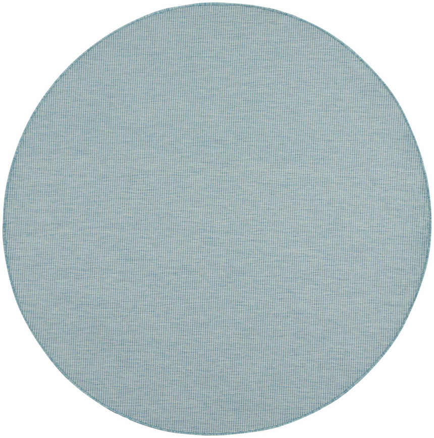 Close-up of a round Nourison Positano Aqua rug. The rug has a woven texture with subtle variations in aqua and white tones.