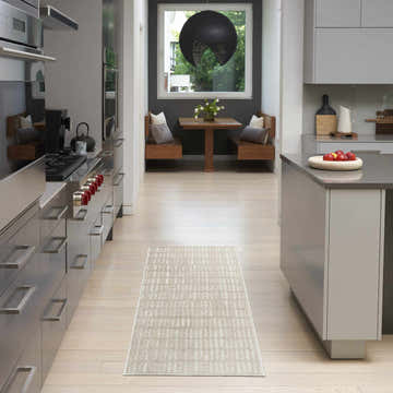 Modern kitchen with stainless steel appliances and Nourison Modern Comfort Grey Ivory rug runner.
