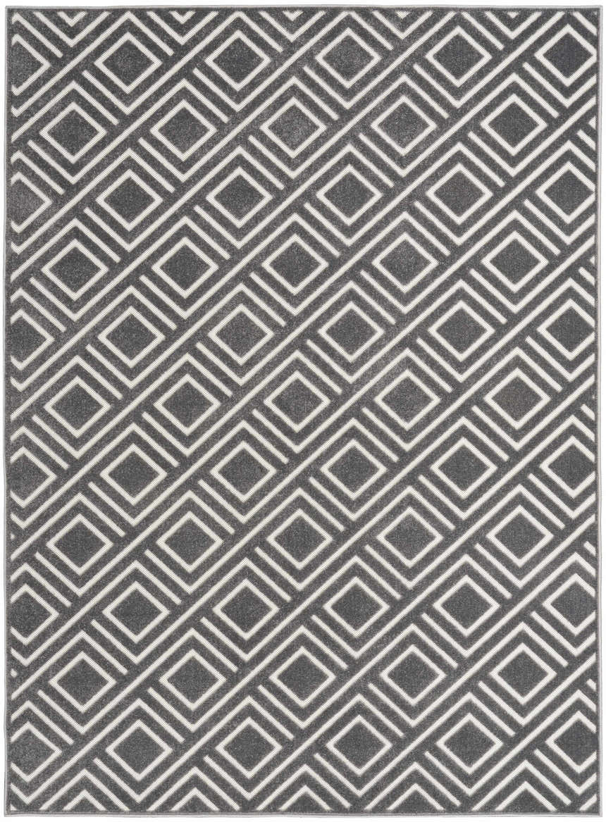 Close-up of the Nourison Care Free Grey rug featuring a modern geometric diamond pattern in gray and white.