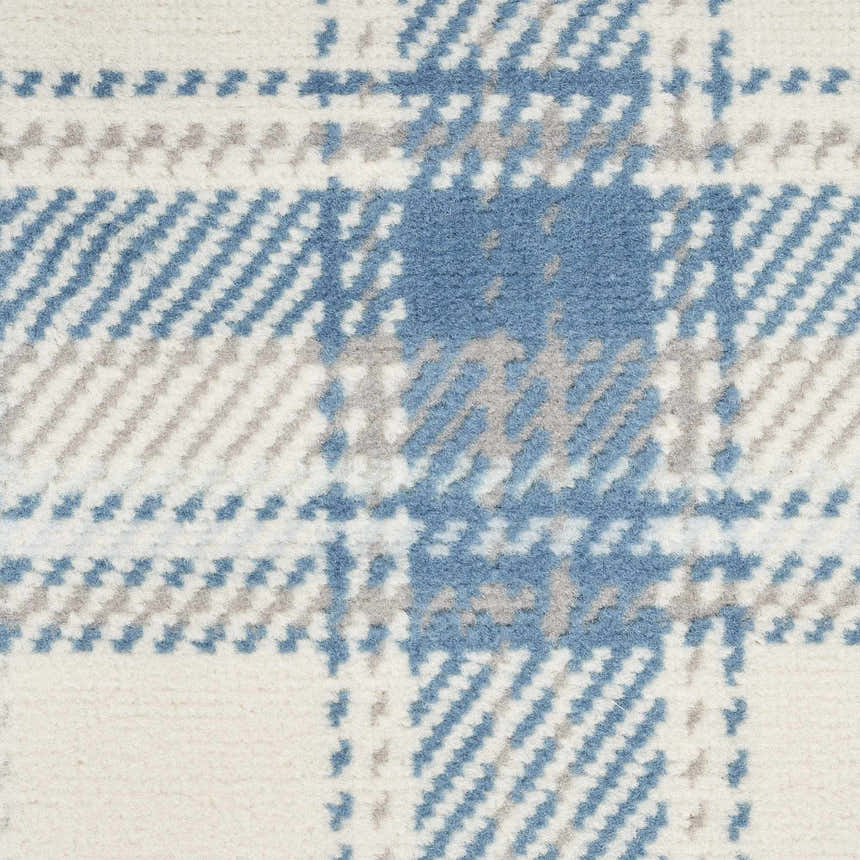 Close-up of Nourison Grafix Ivory Blue Farmhouse rug showing a plaid pattern in ivory, blue, and gray. Soft texture.