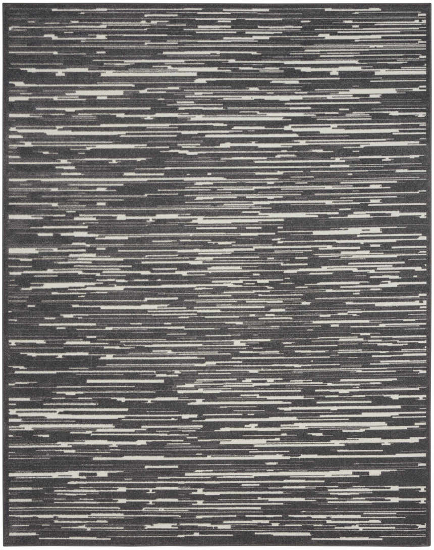 Close-up of the Nourison Care Free Grey rug. Modern design with horizontal stripes in shades of gray and white.