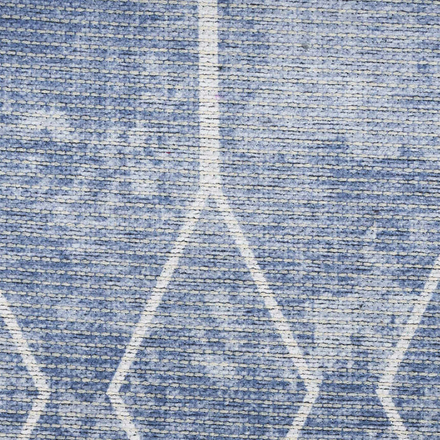 Close up of the Nourison New Concept Blue Modern Rug. Light blue rug with a white geometric pattern. Washable area rug.