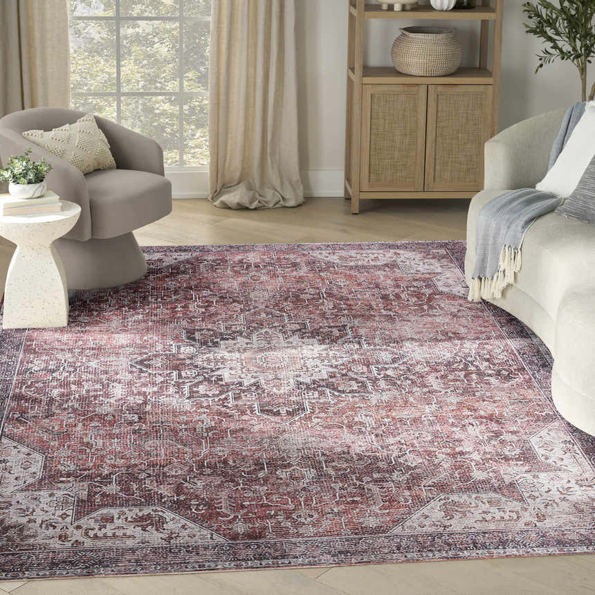 Living room scene with a Nourison Red Vintage Indoor Washable Area Rug, neutral furniture, and light wood floors.