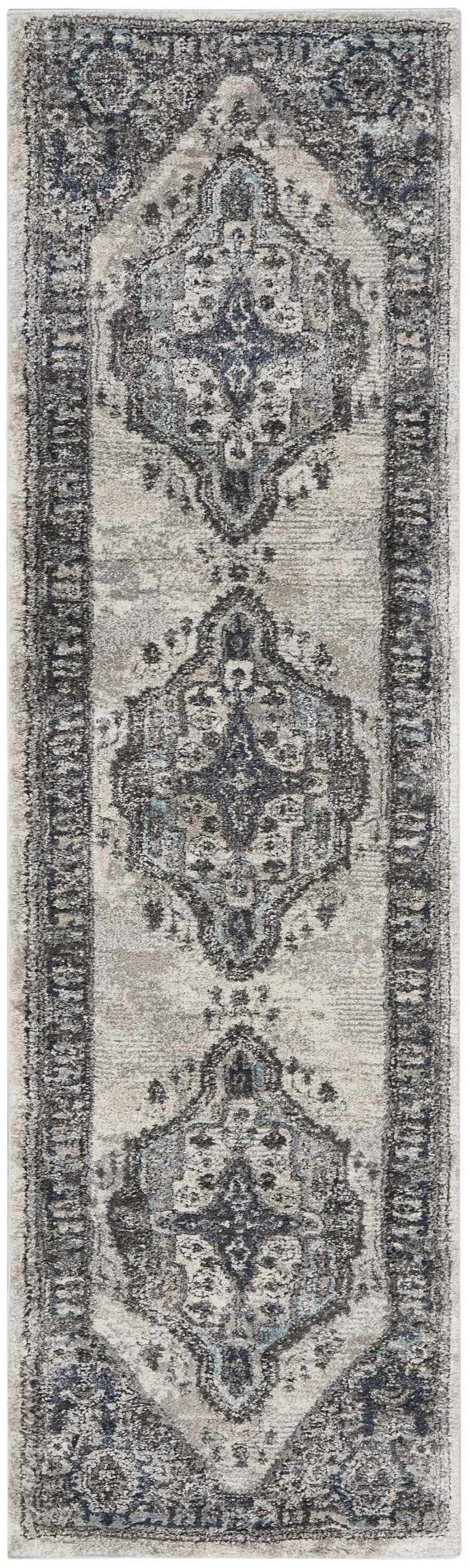 Close-up of the Nourison American Manor Grey Farmhouse Area Rug, featuring a distressed, traditional medallion pattern.