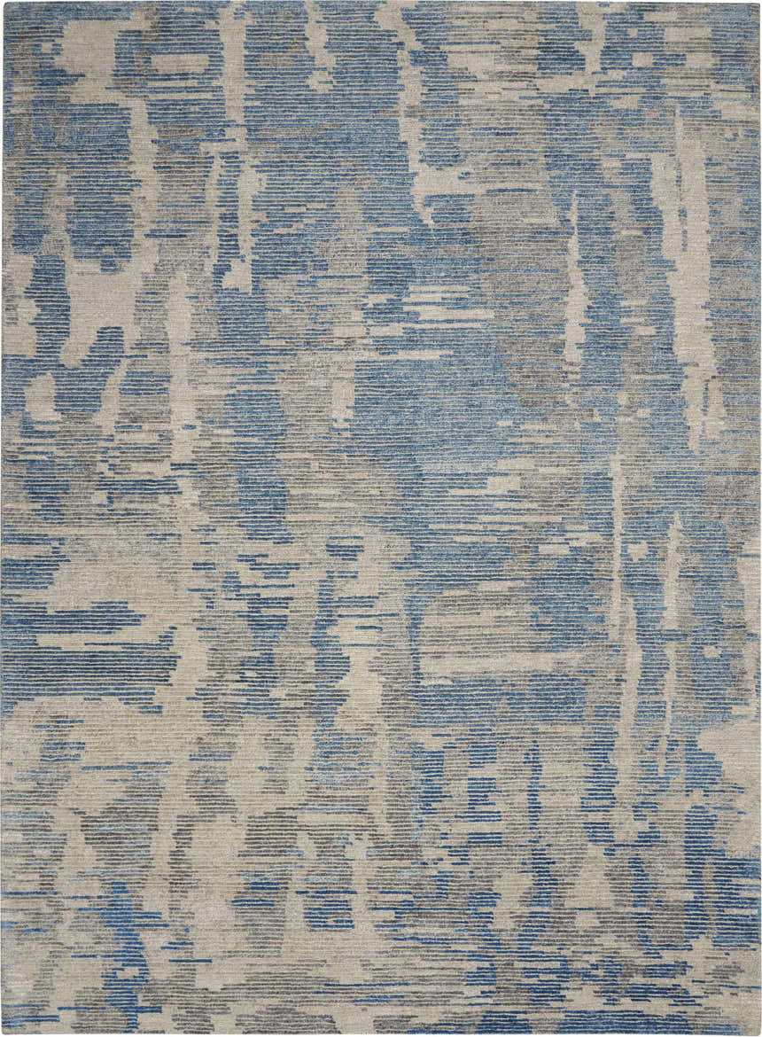 Close up of the Nourison Ellora Blue rug. Modern design with light blue and gray abstract pattern.