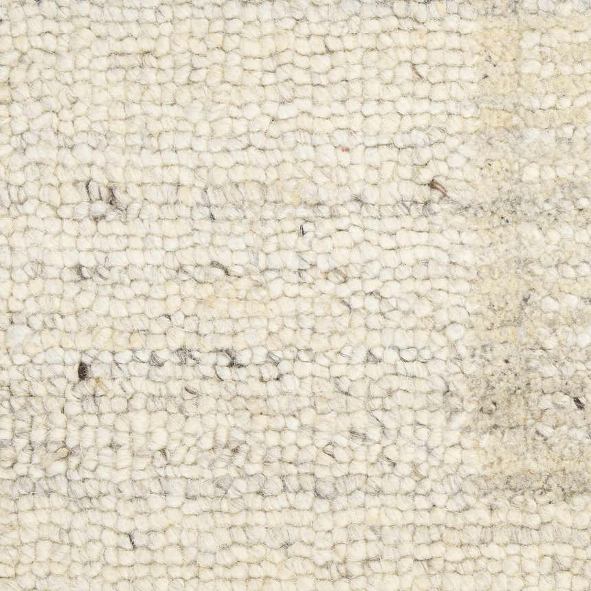 Close-up of the Calvin Klein CK082 Ridge Ivory rug. Shows the wool texture and handmade construction. Chestnut color accents.