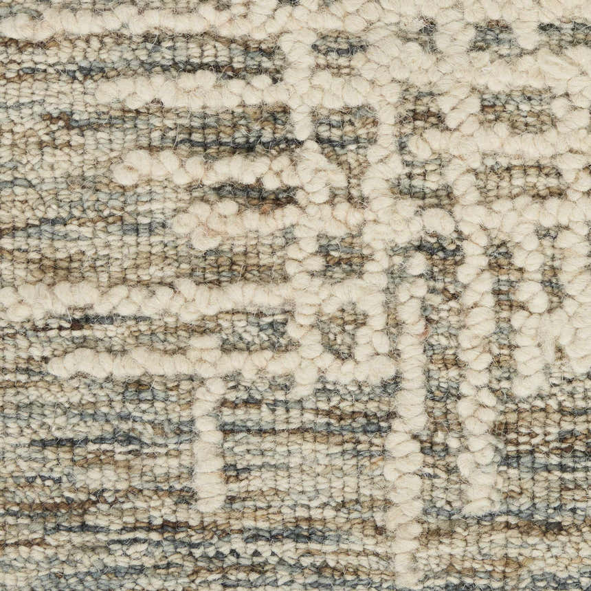 Close-up of the Nourison Colorado Ivory Multicolor Rug. Rustic wool texture with chestnut, ivory, and gray Southwestern pattern.