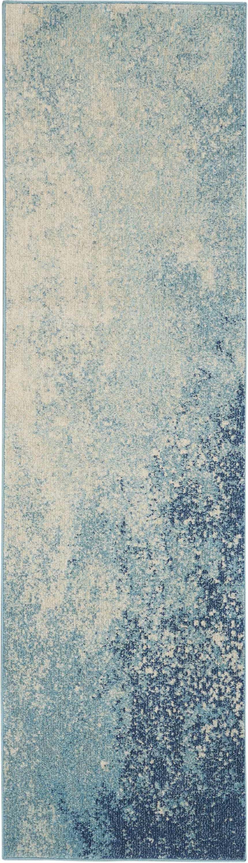 Close-up of the Nourison Passion Navy Light Blue rug, showing its abstract, watercolor-like design and soft texture.