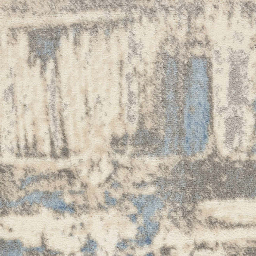 Close-up of the Nourison Solace Ivory Grey Blue Rug, showing its high pile texture and modern abstract design.