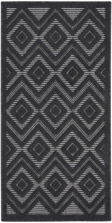 Close-up of the Nourison Versatile Charcoal Black rug. Features a geometric diamond pattern in charcoal and taupe.