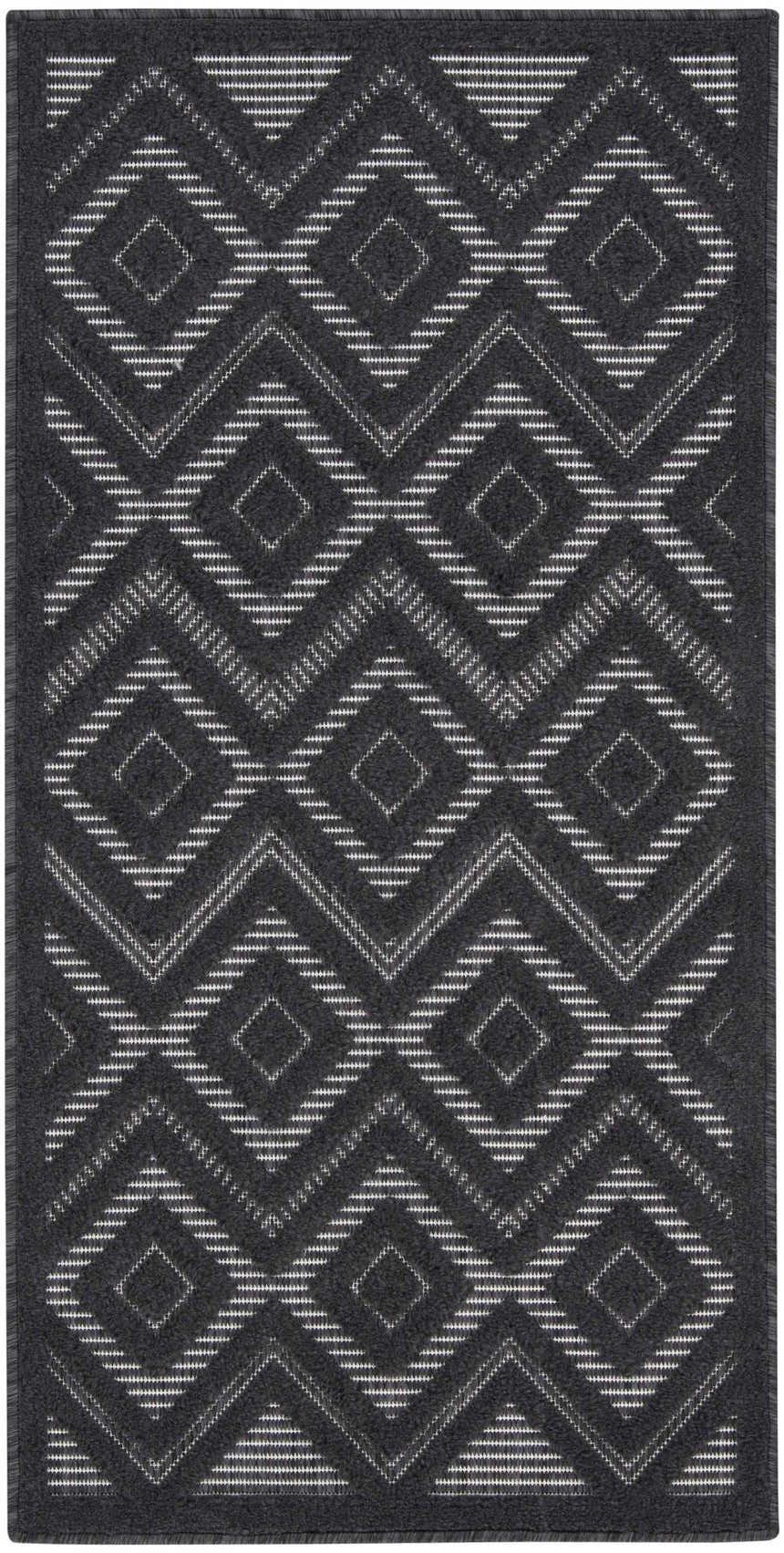 Close-up of the Nourison Versatile Charcoal Black rug. Features a geometric diamond pattern in charcoal and taupe.
