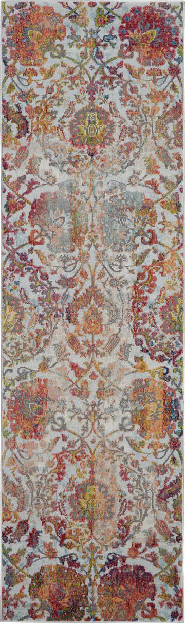 Close-up of Nourison Ankara Global Ivory Orange Vintage Area Rug with floral, distressed design and chestnut, red, and gray colors.