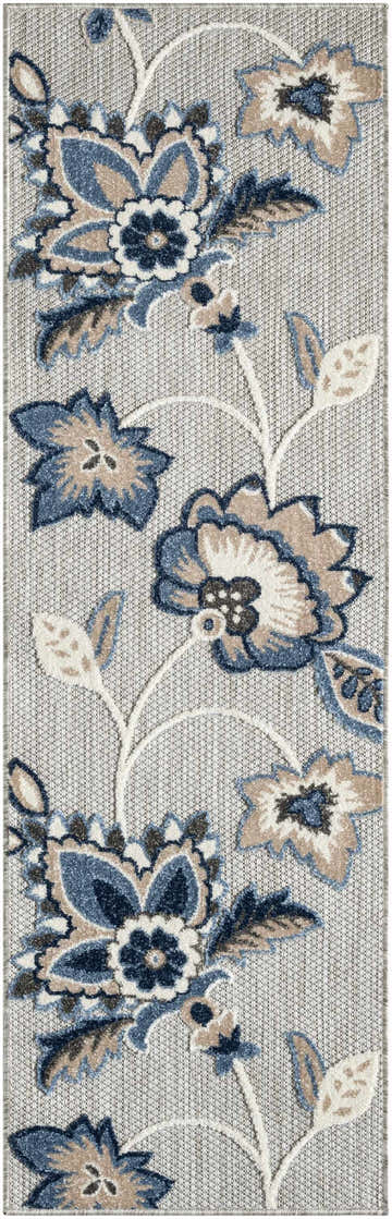 Close-up of Nourison Aloha Blue Grey Outdoor Area Rug featuring a floral pattern in blue, gray, and beige.