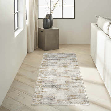 Modern living room with Calvin Klein CK078 Summit ivory multicolor runner rug, neutral sofa, and light wood floors.