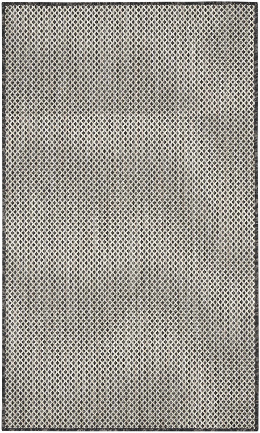 Close-up of Nourison Courtyard Ivory Charcoal rug. Features a diamond pattern in taupe and charcoal hues. Machine-made polypropylene.