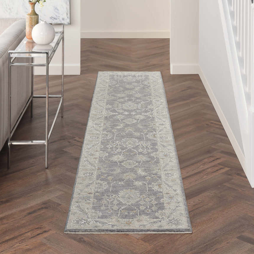 Hallway with taupe Nourison Infinite Charcoal Vintage runner rug on herringbone wood floor.
