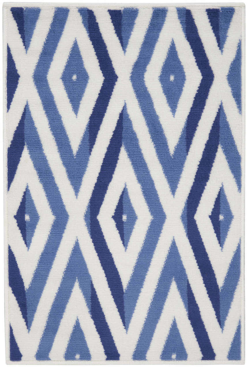 Close-up of Nourison Whimsicle Ivory Blue rug featuring a modern diamond pattern in shades of blue and white. Clearance item.