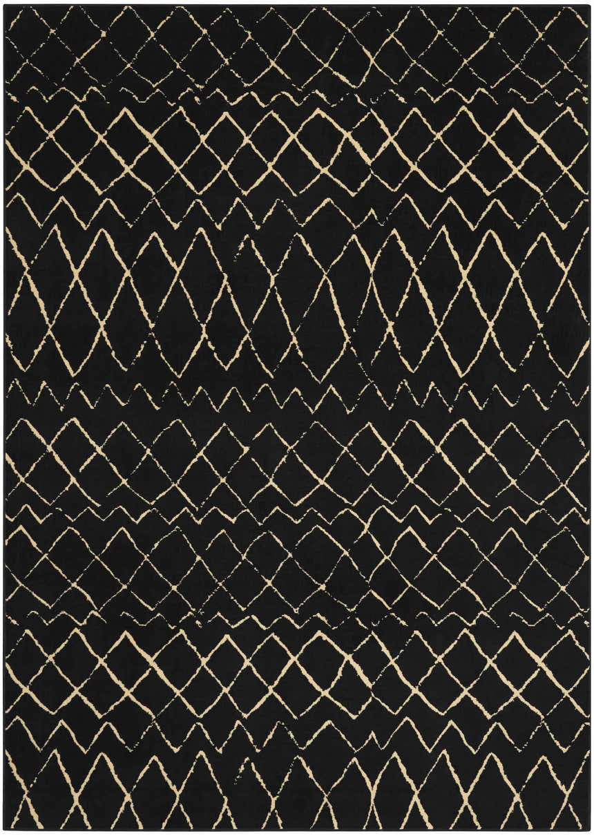 Close-up of the Nourison Grafix Black Bohemian Area Rug, featuring a geometric diamond and zig-zag pattern.