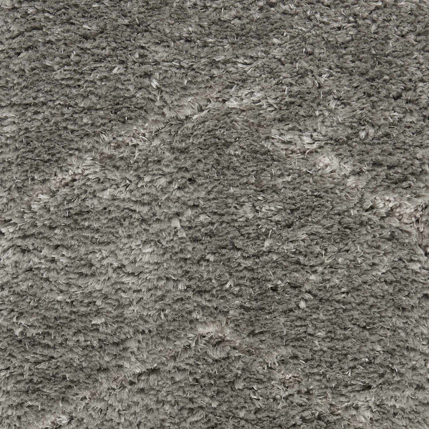 Close-up of the plush texture of the Nourison Dreamy Shag Grey shag rug. Soft, dense polyester fibers.