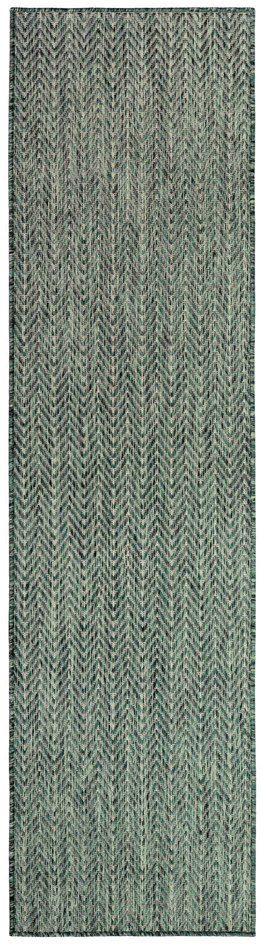 Close-up of the Nourison Horizon green area rug with a modern, textured chevron pattern.